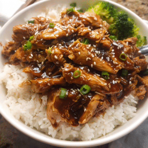 Crockpot Teriyaki Chicken over rice with broccoli and sesame seeds