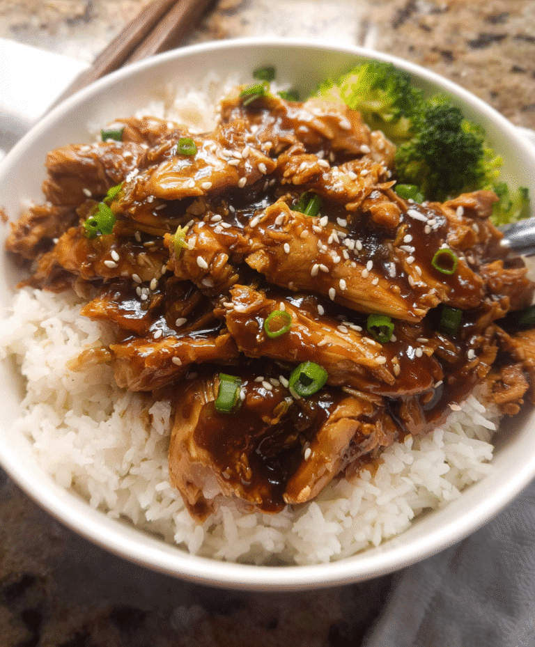 Crockpot Teriyaki Chicken over rice with broccoli and sesame seeds