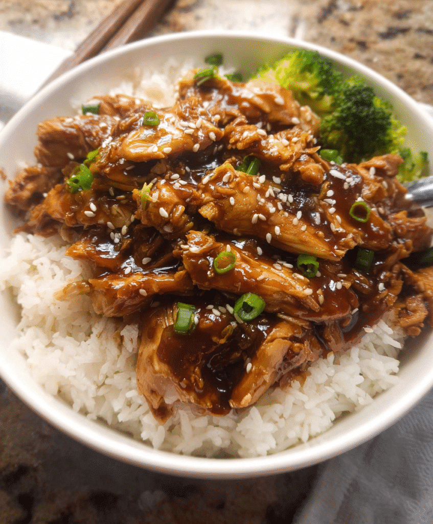 Crockpot Teriyaki Chicken over rice with broccoli and sesame seeds