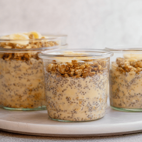 Creamy brown sugar overnight oats topped with crunchy granola and banana slices