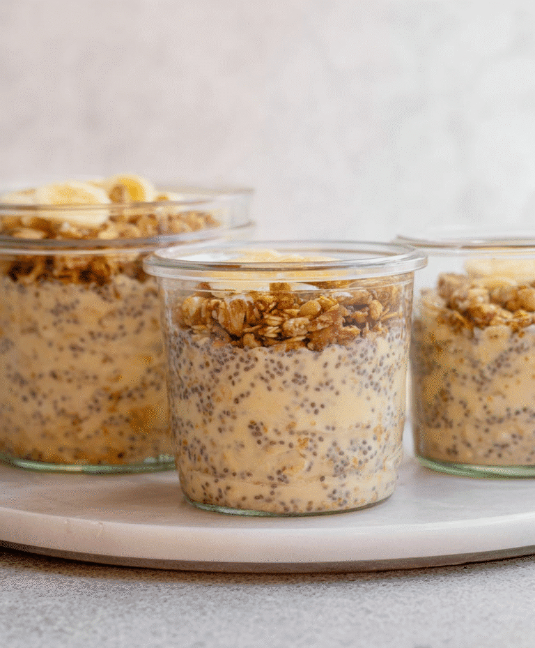 Creamy brown sugar overnight oats topped with crunchy granola and banana slices