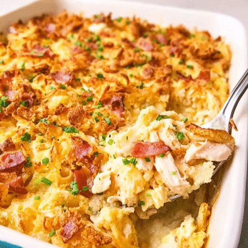 Creamy chicken casserole with bacon and cheese, topped with a golden crispy layer