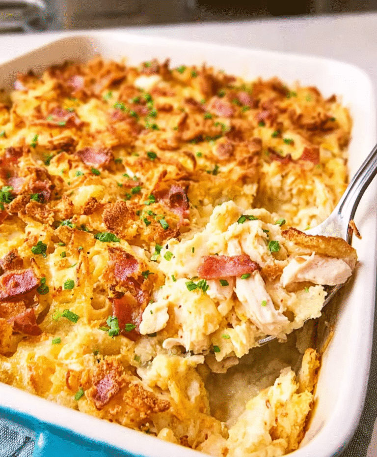 Creamy chicken casserole with bacon and cheese, topped with a golden crispy layer